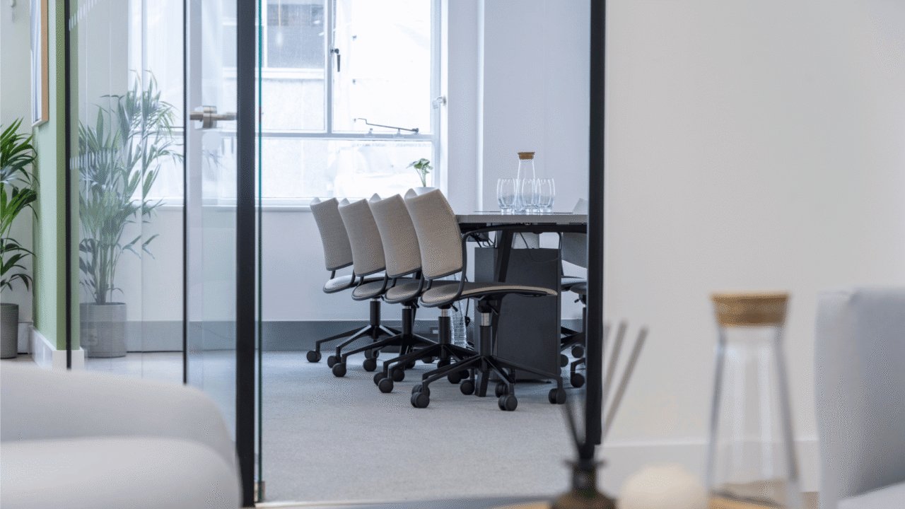 Meeting room with water bottle and table in foreground