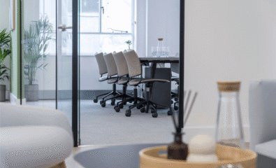 Meeting room with water bottle and table in foreground